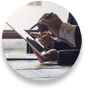 Close up photo of business people holding a pen and holding a tablet