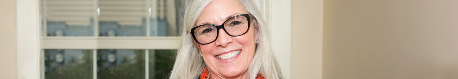 Close up of smiling woman wearing glasses