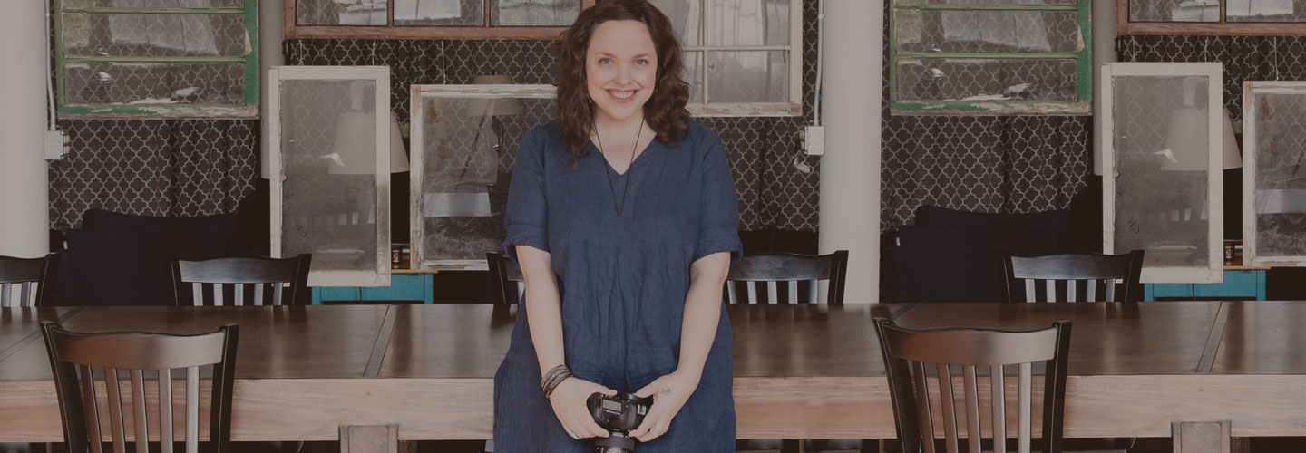 Young woman holding camera